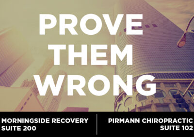 The image features the "Prove them wrong" graphic that was seen on digital screens throughout the facility. The image shows tall buildings located in downtown Los Angeles with a large text that reads, "Prove them wrong."